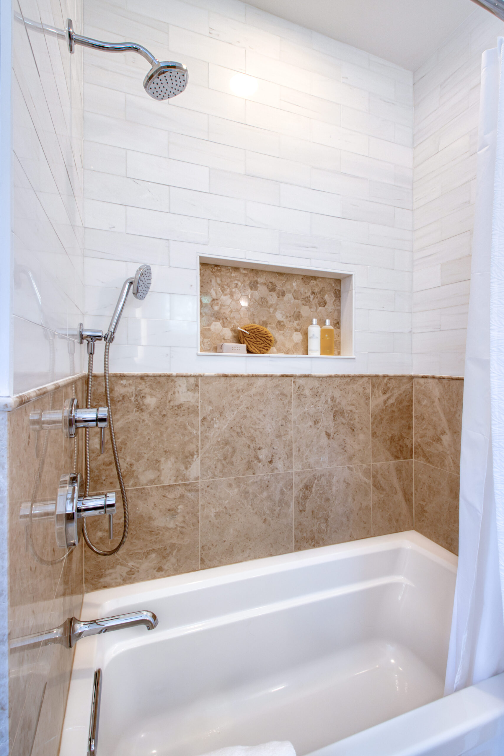 Warm Transitional Bath with Natural Stone Character