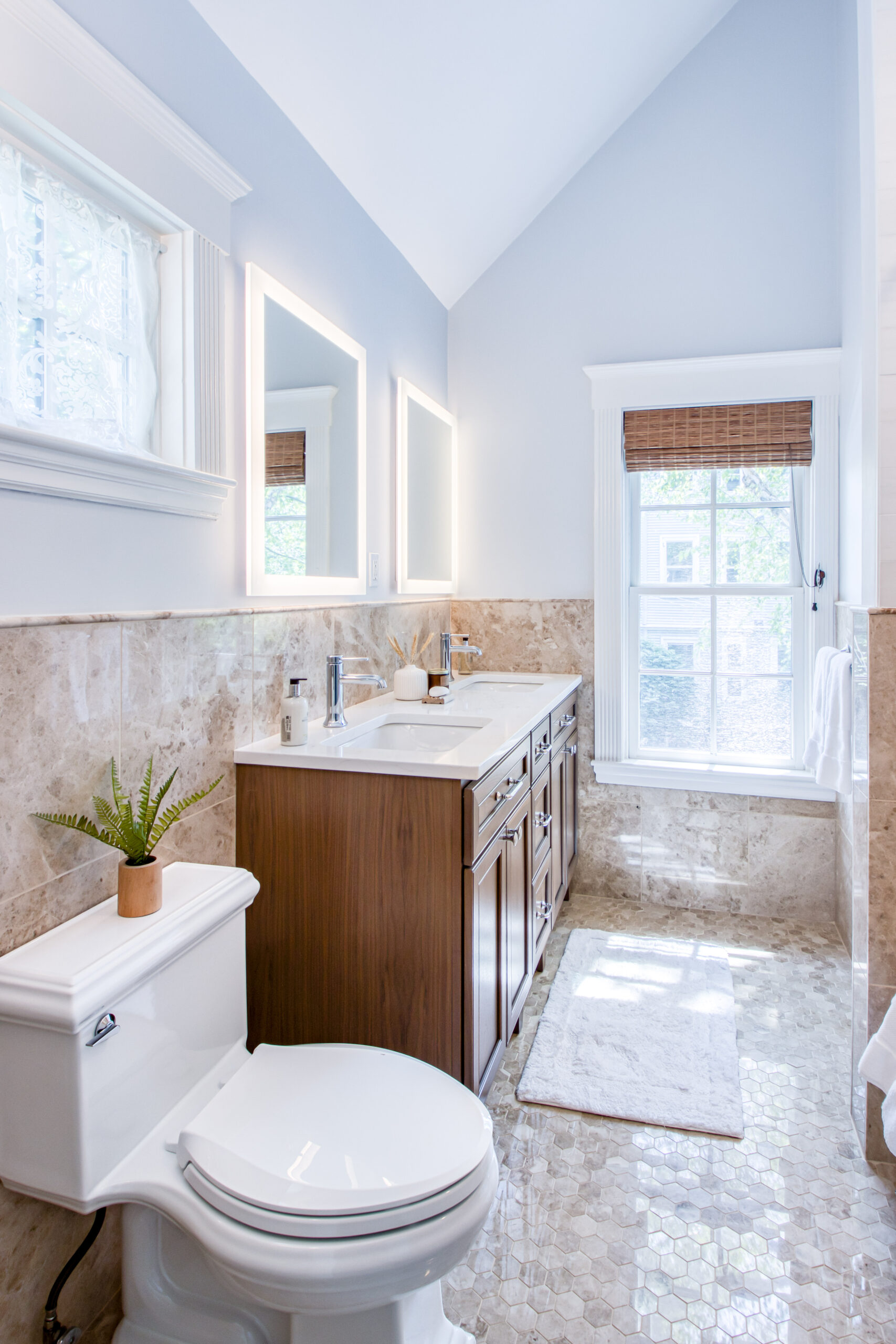 Warm Transitional Bath with Natural Stone Character