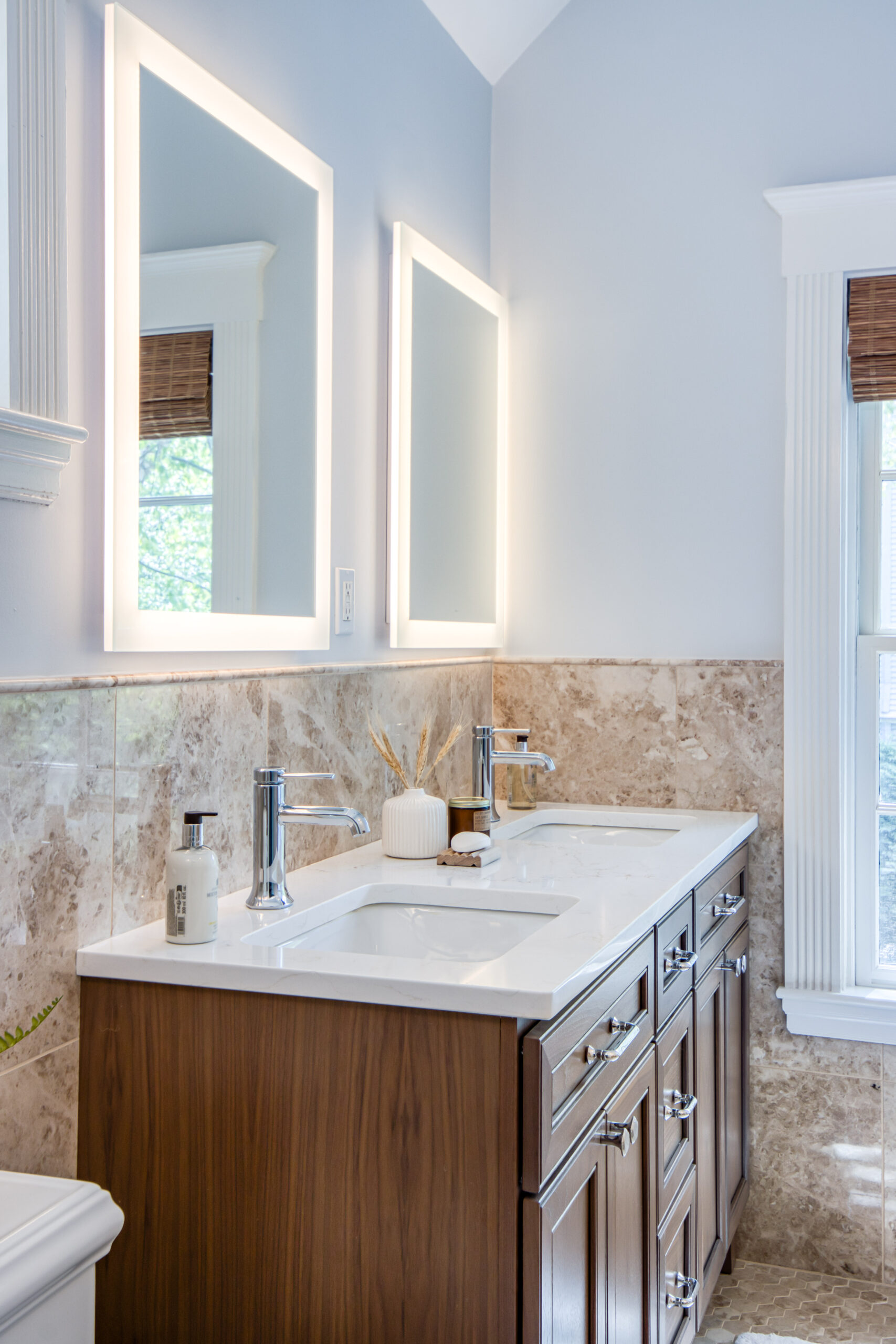 Warm Transitional Bath with Natural Stone Character
